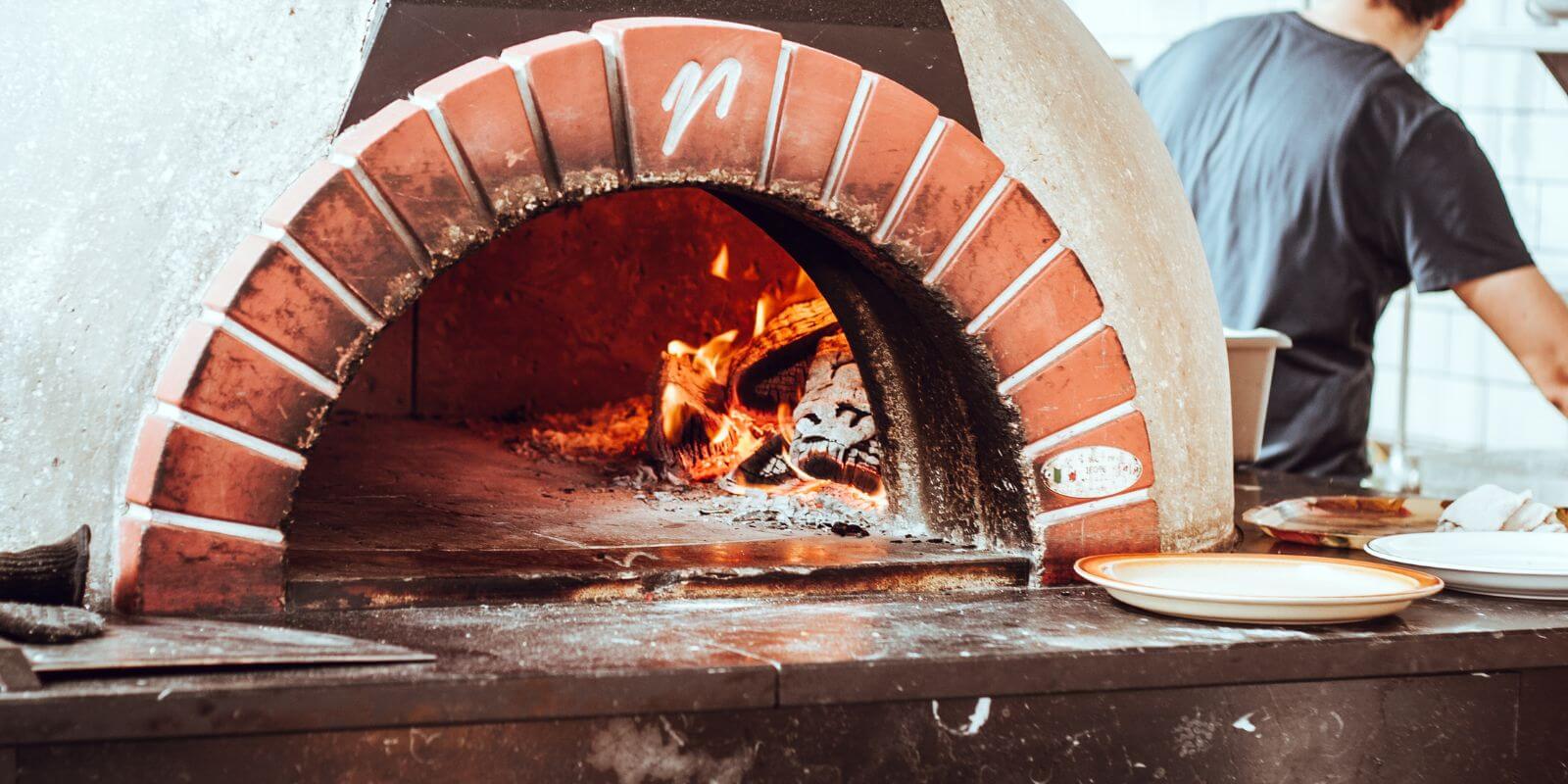 valoriani vesuvio wood fired pizza oven kit in commercial restaurant